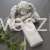 Aniolek na krzyzu dekoracja nagrobna Szary 16x12 cm.jpg